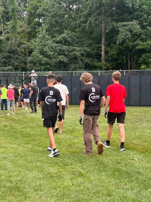 Wadsworth students walk out to the field to help with the build