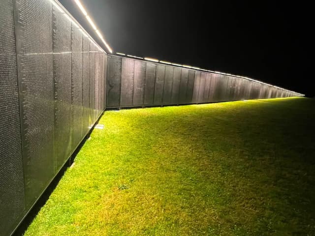 Light washing down the length of the Wall after dark