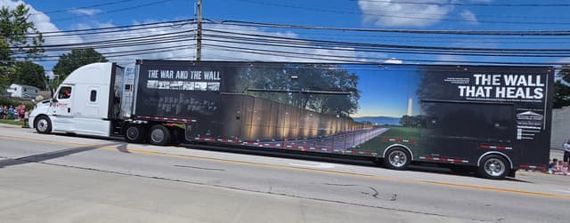 The assembled Wall stretching away toward the treeline