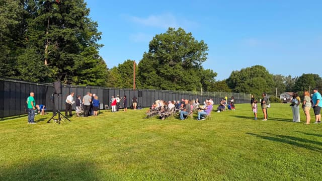 Visitors gathered along the length of the Wall on a clear day