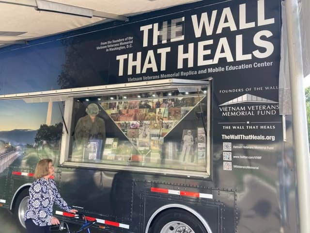A visitor studies the displays inside the Mobile Education Center