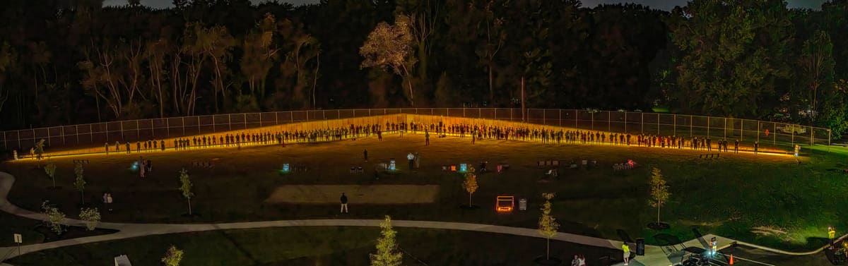 The Wall That Heals lit at dusk at Blue Tip Park, Wadsworth, Ohio
